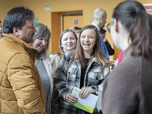 A group of prospective students in the foyer of G I